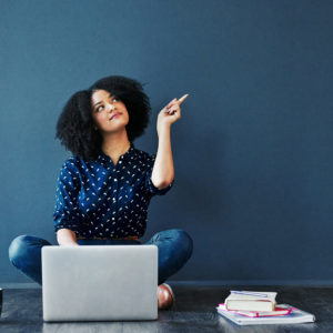 Emphasis - black woman idea on laptop on floor square