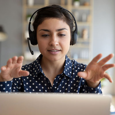 Young professional woman runs a remote learning course on a laptop